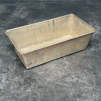 VINTAGE OVENEX EMBOSSED STARBURST TIN