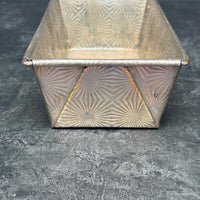 VINTAGE OVENEX EMBOSSED STARBURST TIN