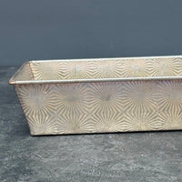 VINTAGE OVENEX EMBOSSED STARBURST TIN