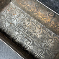 VINTAGE OVENEX EMBOSSED STARBURST TIN