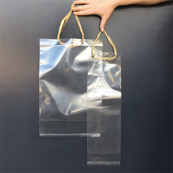 CLEAR RAFFIA HANDLED BAG