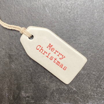 CERAMIC TAG STAMPED WITH MERRY CHRISTMAS