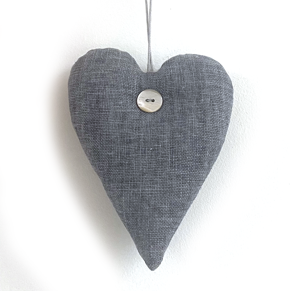 PADDED HEART WITH BUTTON DETAIL